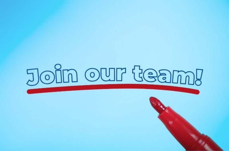 A light blue background with the phrase "Join our team!" written in bold blue letters with a red underline. A red marker is positioned in the bottom right corner as if it has just drawn the underline.