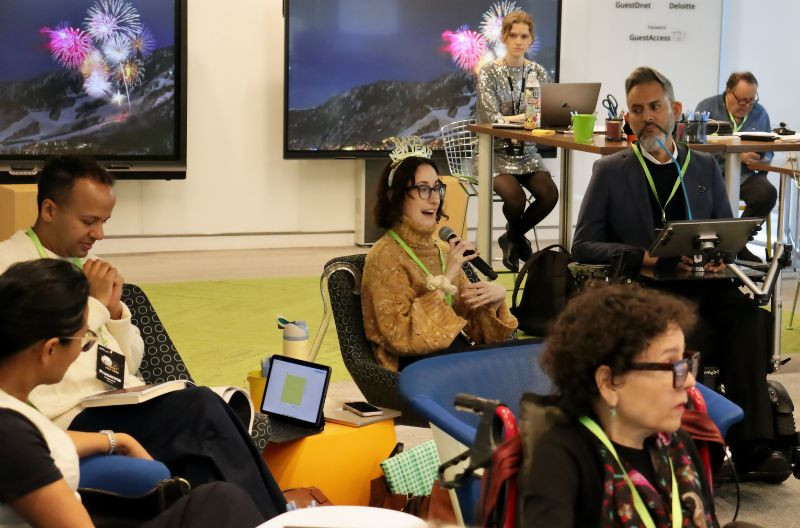 The DSO team participates in a discussion in a conference room.