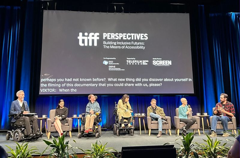 Panelists seated on stage for the TIFF panel titled 'PERSPECTIVES: Building Inclusive Futures: The Means of Accessibility.'