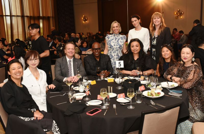 A screen displays nominees