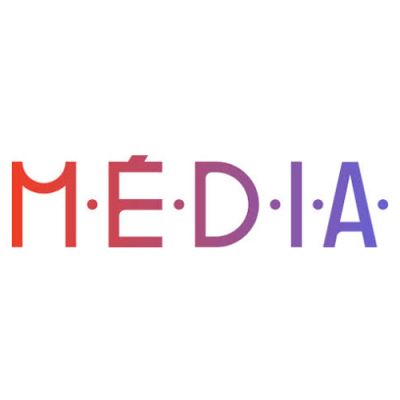 The DSO delegation is standing on a red carpet in front of a backdrop featuring the Toronto International Film Festival (TIFF) logo and sponsor logos. The group is diverse in appearance, with a mix of genders and ages. From left to right, we see Tieren Hawkins, Nisha Platzer, Maxine Grossman, Cass Rudolph, Winnie Luk, Alethea Bakogeorge and Elspeth Arbow. All are smiling and posing for the photo.